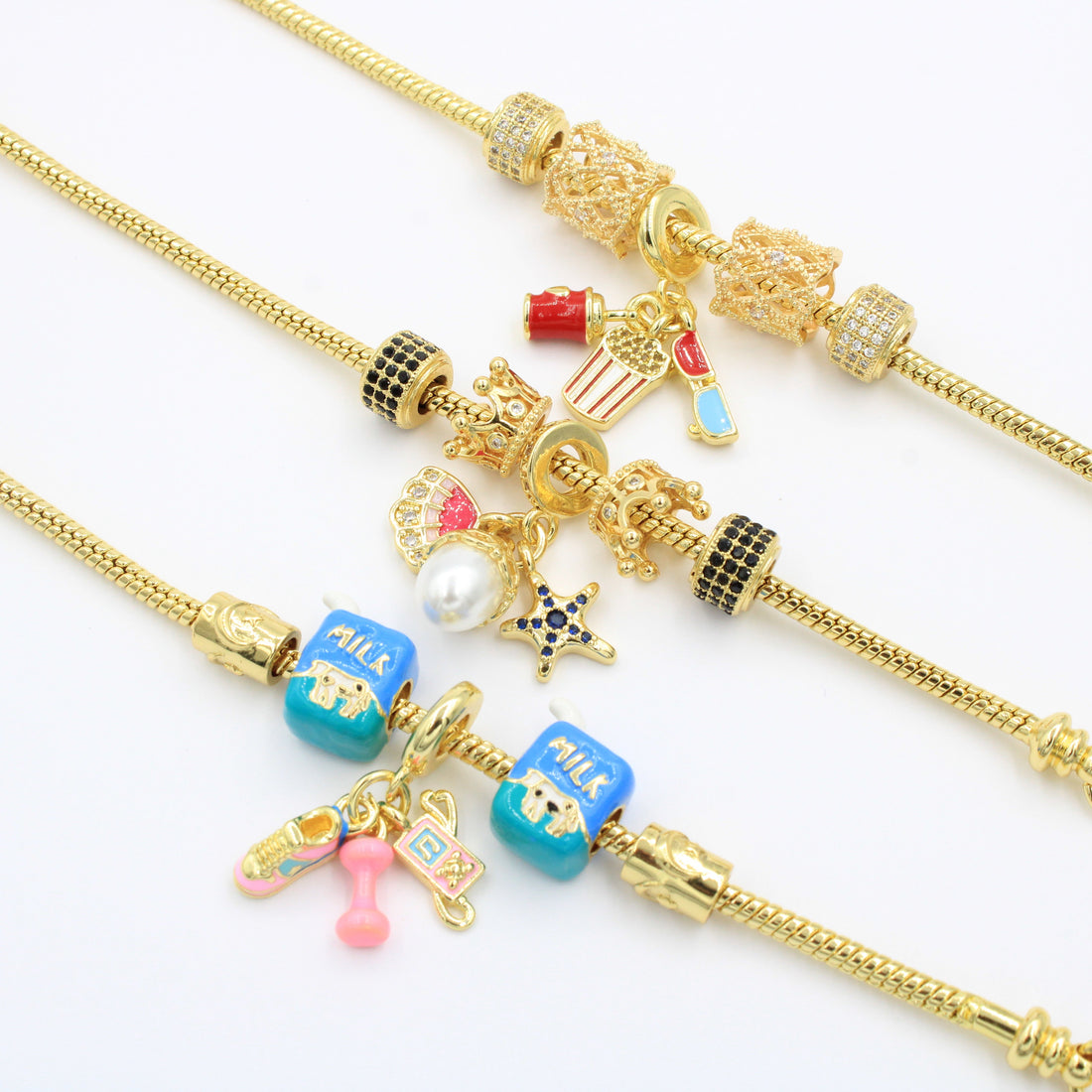 Paquete Pulseras 3pz con Dijes Fancy mod. 13015