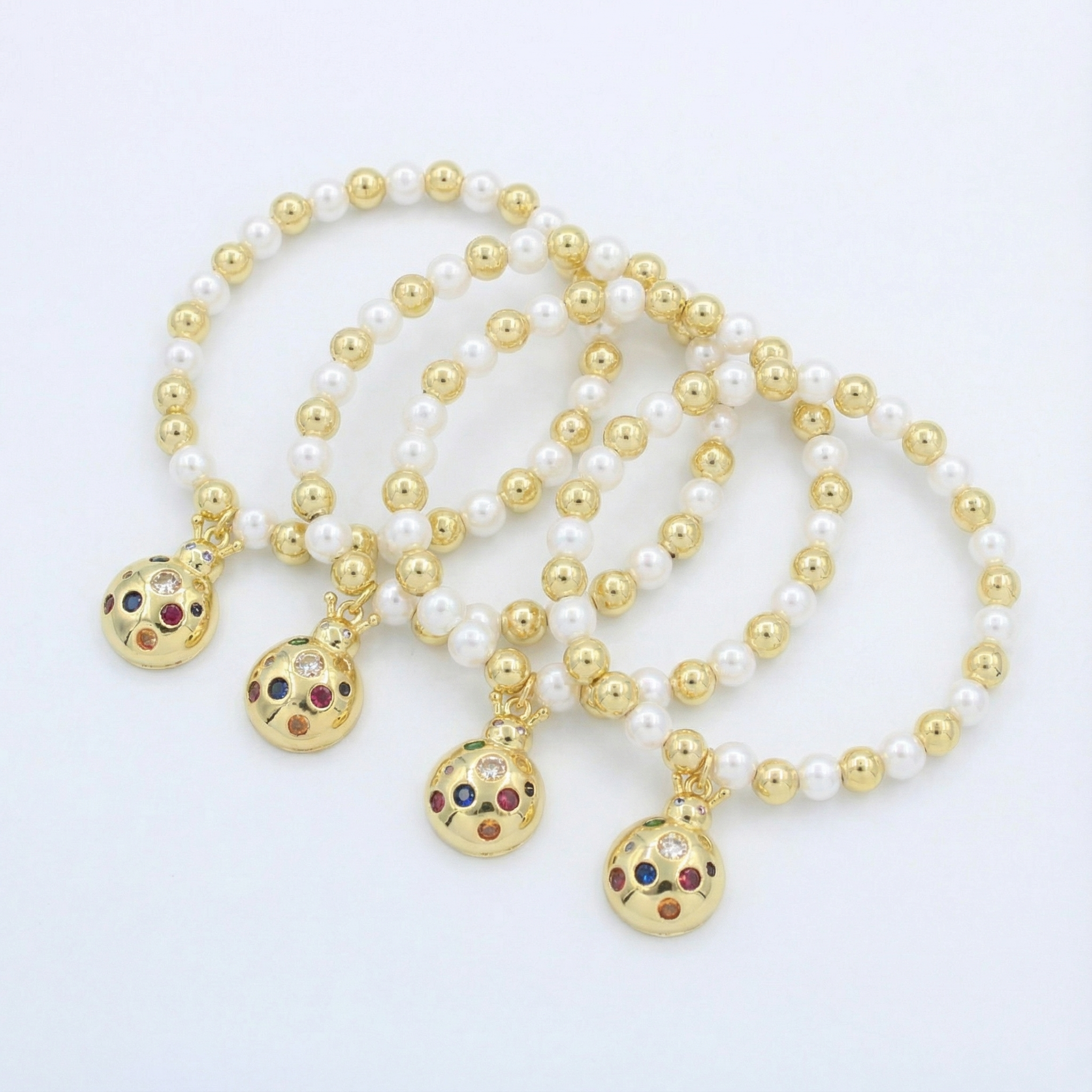 Paquete Pulsera Goldfilled 4pz con Esfera Colgante Brillante mod. 13035